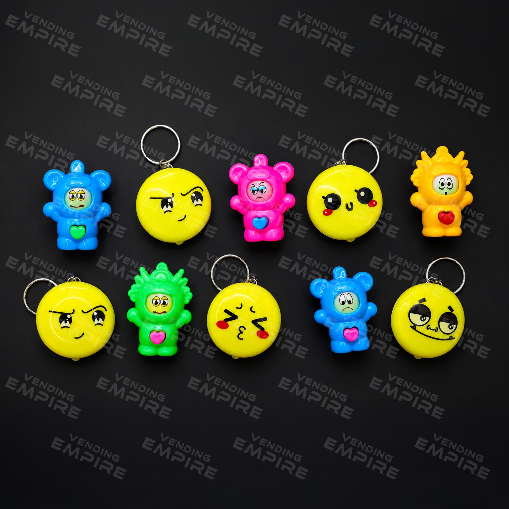 Mix de Muñecos Cambia Cara con Llaveros Emoji – Para Máquina Vending de 2” (Con Cápsula)